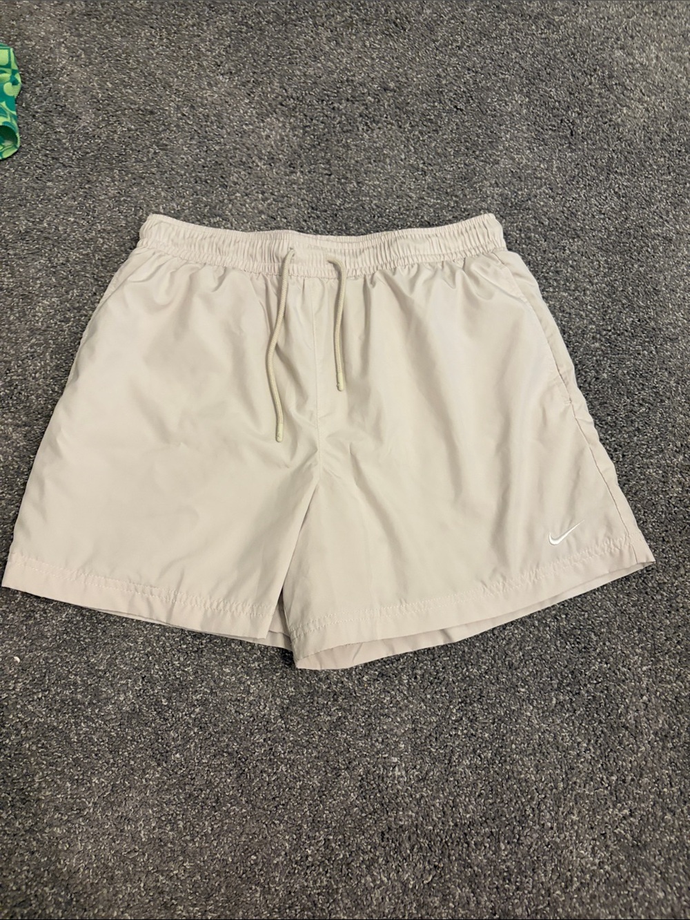 Nike Light Tan Athletic Shorts with White Swoosh